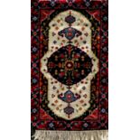 Small full pile Turkish rug or prayer mat with central deep blue floral medallion, 125 x 60cm