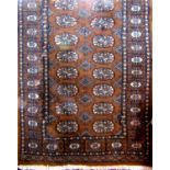 Small Turkamen Bokhara rug, with typical geometric decoration upon a light brown ground, 130 x 80cm