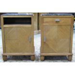 A pair of Art Deco style light oak bedside/drawing room cupboards with inset veined marble tops, one