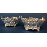 Good quality pair of Edwardian cast silver bon bon dishes with floral pierced sides, maker C S H,