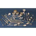 A mixed collection of silver and silver plate to include napkin rings, various teaspoons and