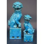 Two graduated oriental turquoise glazed models of seated dogs of fo, maximum height 31 cm