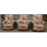 An Ercol Golden Dawn Renaissance three piece suite with loose floral patterned cushions, together