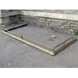 A large country house size brass fender with raised tubular rail and moulded curb, 198 cm wide x