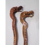 Pair of Chinese carved hardwood walking sticks, with dragon head handles (2)