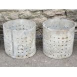 A pair of small perforated lead planters of cylindrical form, 20cm diameter x 20cm high