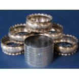 Set of six silver napkin rings with wavy rings and engraved bowls, maker S & Co, Birmingham 1896,