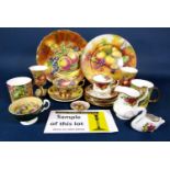 A quantity of Aynsley teawares with fruit decoration in the Royal Worcester style comprising