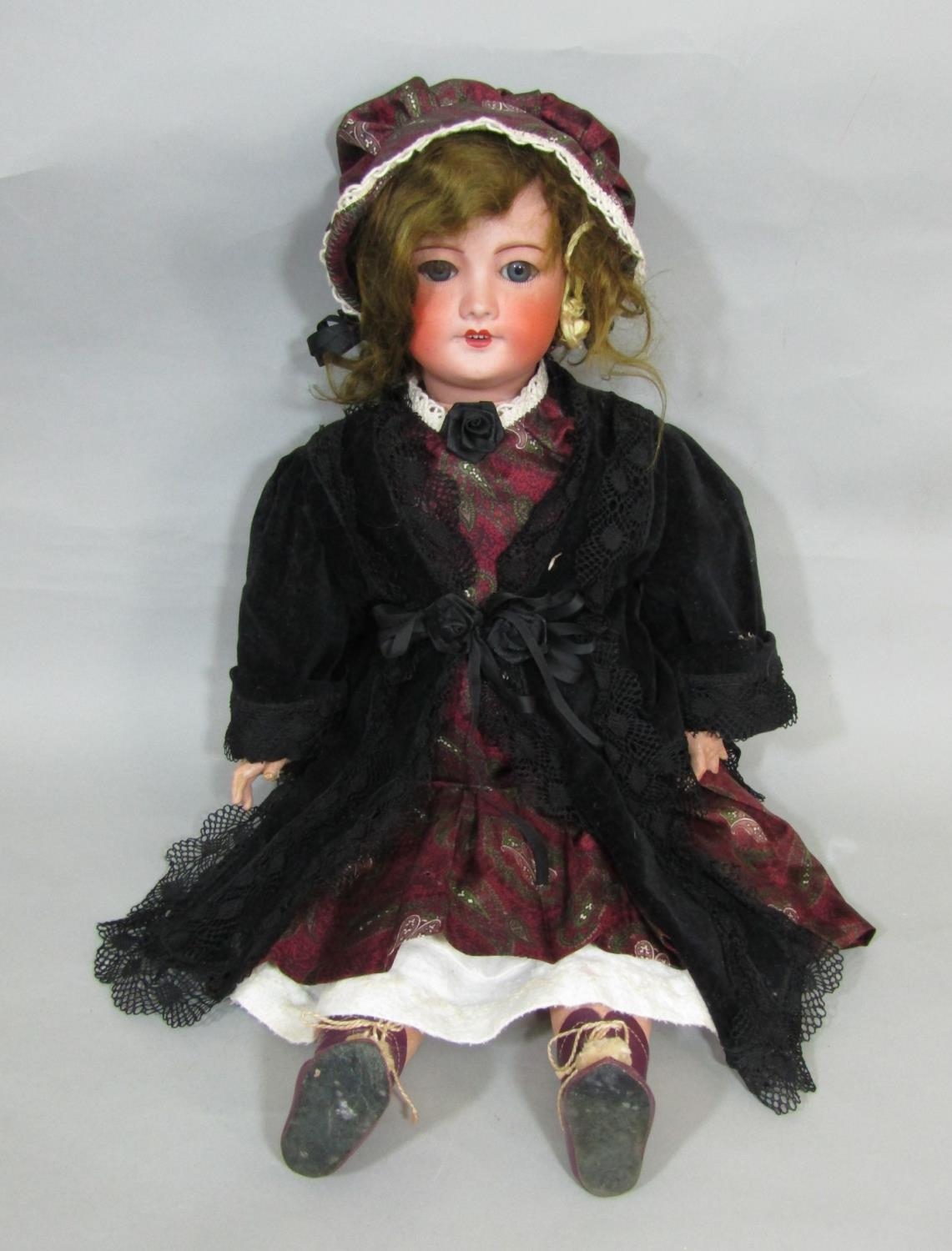 Bisque head doll made by SFBJ with jointed composition body, closing blue eyes, open mouth with 4