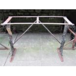 A cast iron pub/garden table with decorative pierced thistle and rose design to end supports, (lacks