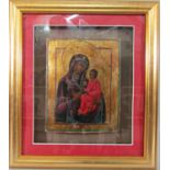 An eastern European icon (probably 19th century) three quarter length portrait of the Virgin and