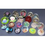 A large collection of Caithness glass paperweights, many with original boxes