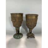 Interesting matched pair of Benin bronze goblets with applied cow horn band, the largest 26cm high