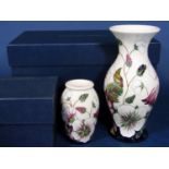 Two boxed Moorcroft cream ground vases in the Bramble Revisited pattern, both with impressed and