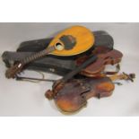 Cased violin labelled Ernst Crichton with bow and case, further violin (Af) and a cased mandolin