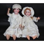 2 early 20th century German bisque head dolls; the taller doll 67cm has head by Armand Marseille,