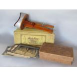 Two boxes containing a stereoscope and slides