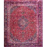 Large full pile Hamadan country house carpet with typical central blue floral medallion, further