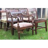 A pair of good quality Regency mahogany scrolled bar back dining chairs with turned splats,