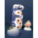 A Royal Crown Derby imari type paperweight in the form of a chipmunk, together with two Royal