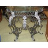 A contemporary ironwork occasional table of the Rococo style with repeating detail and set beneath a