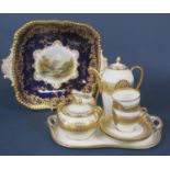 A continental coffee for two set with blue and gilt decoration on a white ground comprising coffee