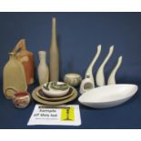 A collection of Studio pottery wares of various design and make including a set of three white