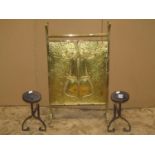 An Art Nouveau embossed brass firescreen with geometric detail, together with a pair of Art