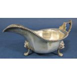 Good quality early 20th century Georgian style silver sauce boat, with beaded handle and rim,