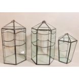 Pair of leaded glass pagoda shaped terrariums, 32cm high, together with a smaller tapered example (