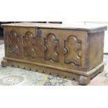 18th century or earlier oak coffer, the front elevation enclosed by four repeating panels with