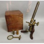 John Browning of London good quality cased brass microscope with painted ironwork frame within a