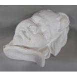 Hanging plaster bust of a child's face stamped D Brucciani London 40cm high