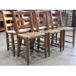 A set of six vintage stained beechwood chapel chairs with triple bar backs and hymn book
