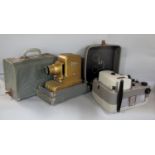 Two vintage cased projectors