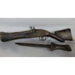 Antique Albanian dagger with primitive wooden handle, together with an eastern blunderbuss type