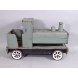 A large vintage wooden toy train with wheels and painted finish, length 59cm (AF)