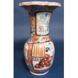 A late 19th century oriental vase with flared neck and polychrome painted figure and floral