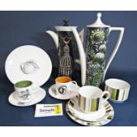 A set of Susie Cooper harlequin coffeewares with black and white fruit decoration and different