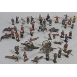 A collection of lead figures, some with 'Britains' mark, including WW1 soldiers, Scottish Guards,