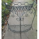 An iron work floorstanding demi lune two tier garden or conservatory planter, with repeating ring,