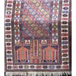 A Turkish full pile rug with architectural decoration upon an ivory ground, 190 x 115 cm