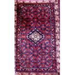 Persian Hamadan full pile rug with central pale blue floral medallion scrolled by further blue block
