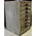 A vintage heavy gauge steel industrial eight drawer filing cabinet with painted finish and