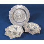 Pair of Edwardian silver bonbon dishes with raised pierced sides and embossed decoration, maker