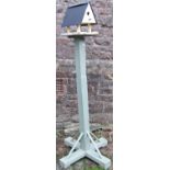 A light green and cream painted rustic wooden bird table and combined nesting box, 174cm high