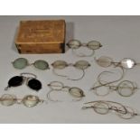 A collection of vintage gold rimmed spectacles