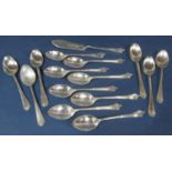 Harlequin set of twelve silver Albany handled teaspoons, together with a similar silver butter knife