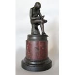 Grand Tour bronze study of the boy with thorn, upon a red marble and slate stepped circular column