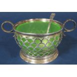 Good quality art deco silver twin handled jam pot, with green glass liner and pierced geometric